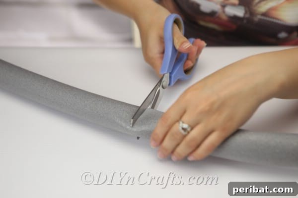 Coastal Elegance: Craft Your Perfect Summer Wreath 7 Cut a section of foam tube to use for the wreath base.