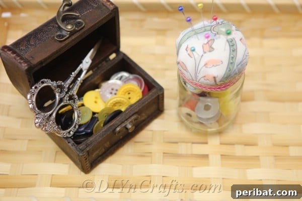 Clever Pincushion Jar Sewing Caddy 19 A completed pincushion jar sits prominently in a woven basket, surrounded by other essential sewing items, ready for a creative session.