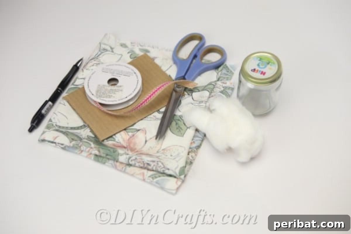 Clever Pincushion Jar Sewing Caddy 5 Various materials laid out neatly on a wooden surface, including a glass jar, fabric swatches, ribbon, scissors, and a glue gun, ready for the pincushion jar project.
