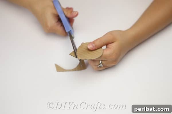 Clever Pincushion Jar Sewing Caddy 8 Continuing to cut the cardboard circle, ensuring a precise and even shape for the pincushion base.