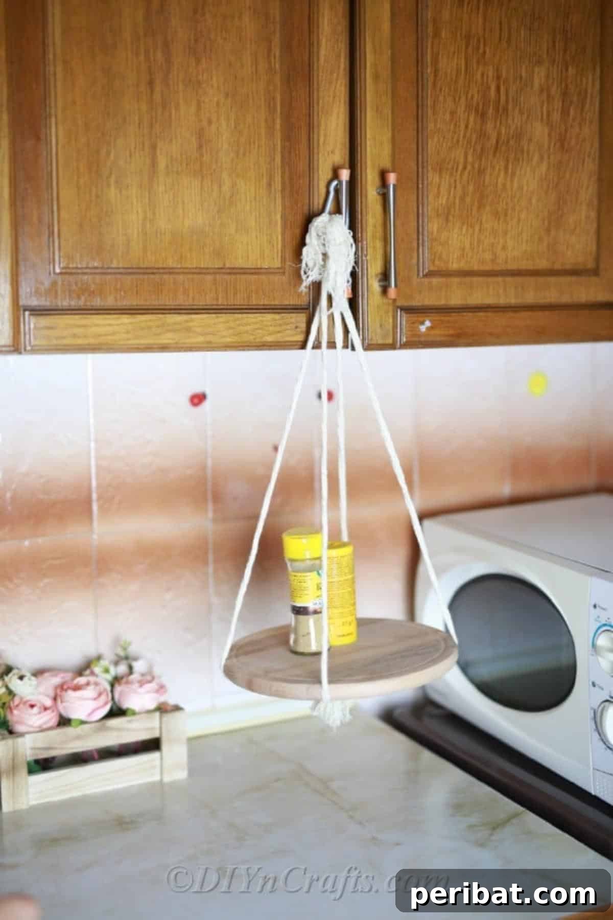 Make Your Own Decorative Hanging Shelf 2 A beautifully crafted hanging shelf in a modern kitchen, showcasing functional yet stylish storage for small homes.