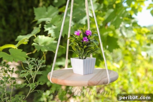Make Your Own Decorative Hanging Shelf 17 A DIY hanging shelf showcasing a delicate flower, with soft foliage blurred in the background, perfect for botanical displays.