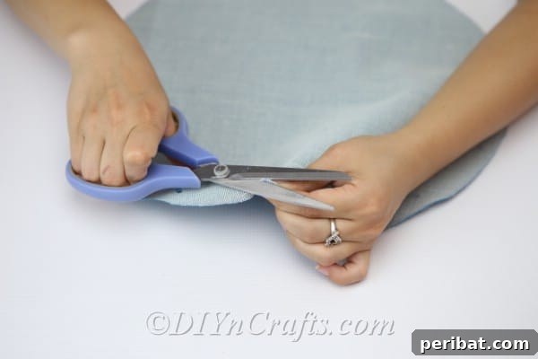 Craft a Trendy Handbag Without a Needle 12 Cut little holes out where you put your marks along the edge of the semi-circle.