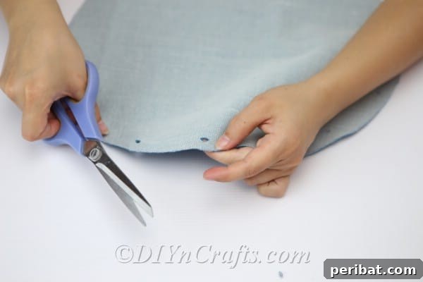 Craft a Trendy Handbag Without a Needle 13 Continue making your little holes along the edge.