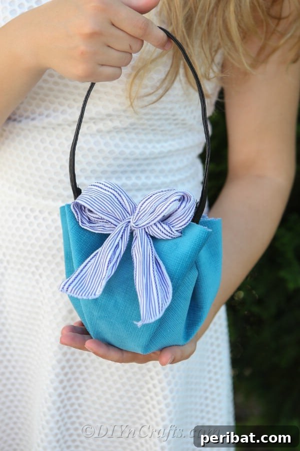 Craft a Trendy Handbag Without a Needle 19 A woman holding a DIY handbag.