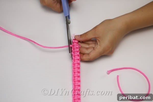 Create Your Own Square Knot Friendship Bracelet 18 Trimming the ends of the thread from the square knot bracelet