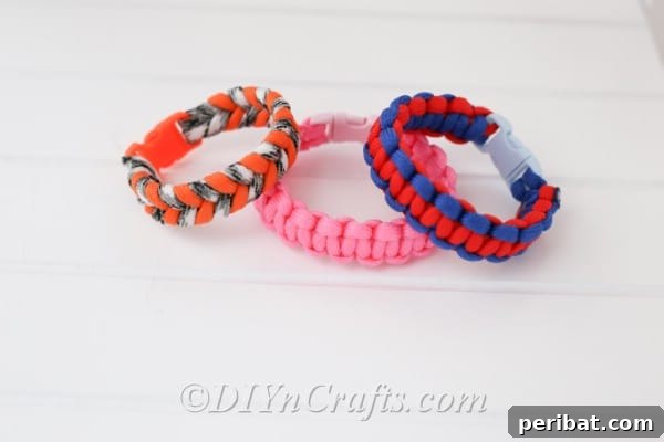 Square knot bracelets stacked together on a white surface
