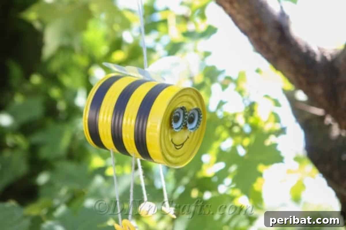 DIY Whimsical Hanging Garden Bees 3 Cute hanging tin can bee decorating a garden.