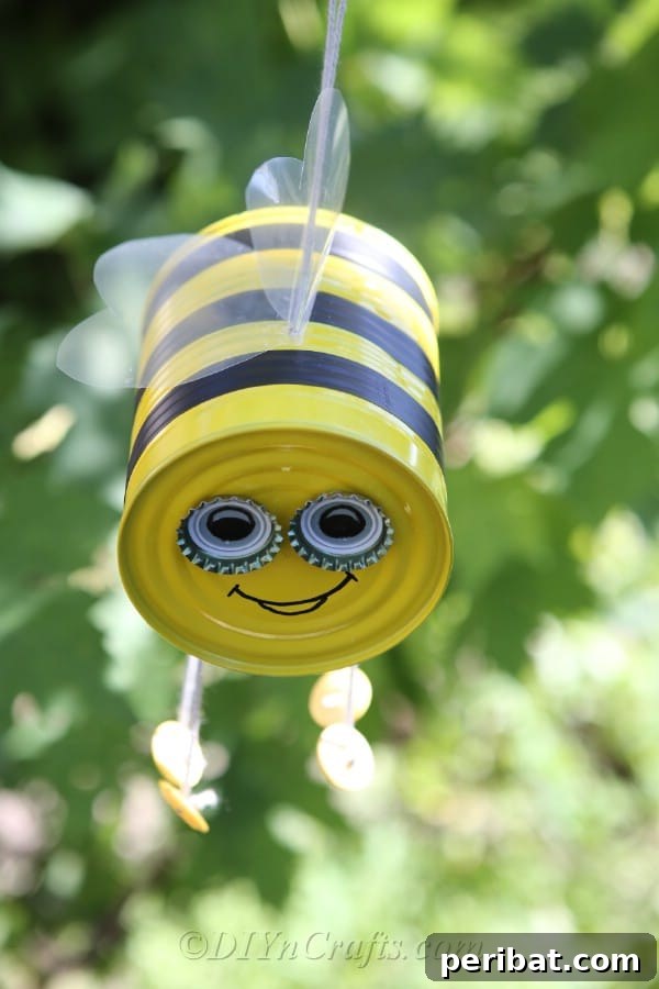DIY Whimsical Hanging Garden Bees 21 Up close picture of bee craft tin can hanging in a tree