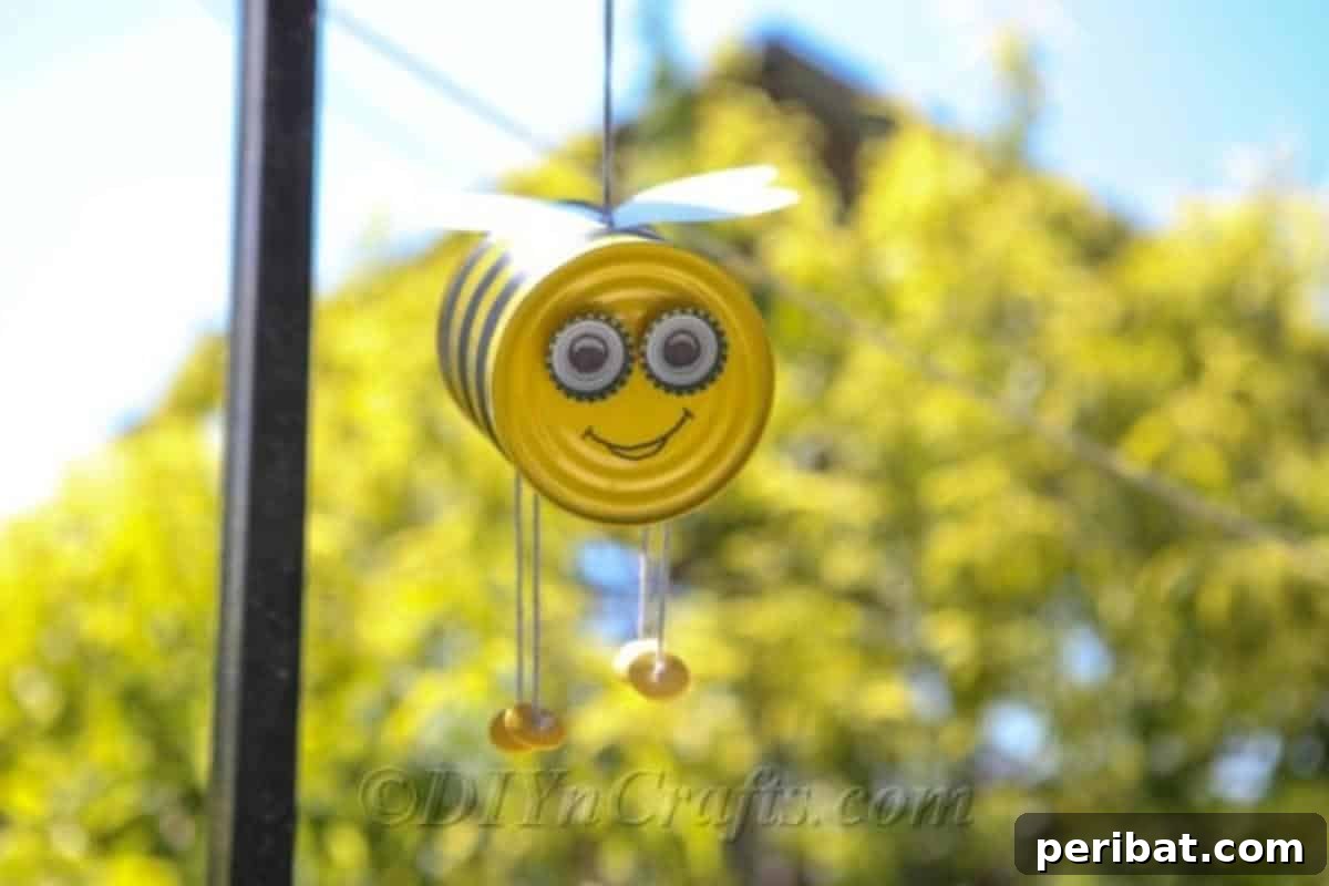 DIY Whimsical Hanging Garden Bees 4 Tin can bee craft hanging from a porch