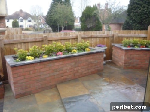 Stunning & Simple DIY Flower Bed Projects for Outdoor Appeal 26 Raised Brick Flower Bed matching a brick home