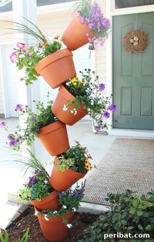 Stunning & Simple DIY Flower Bed Projects for Outdoor Appeal 6 Towering Flower Beds made from stacked terra cotta pots