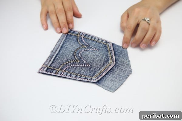 Craft Your Own Chic Denim Bag 16 Picture showing removed pocket with extra material around the bottom, ready for customization.