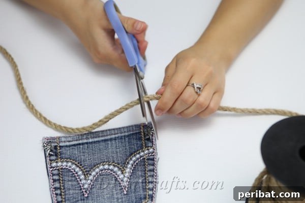 Craft Your Own Chic Denim Bag 20 Process of carefully measuring a rope handle for the DIY denim bag pocket purse.