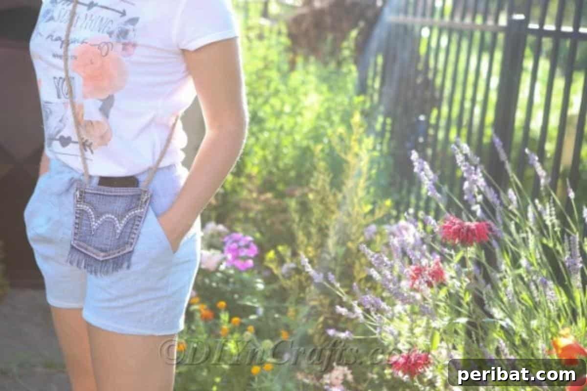 Craft Your Own Chic Denim Bag 4 Woman standing elegantly by a vibrant flower garden, showcasing her handmade denim purse with a stylish rope strap.