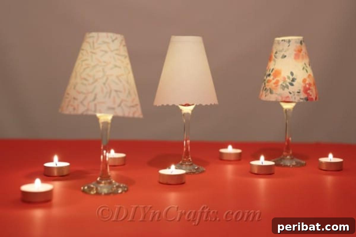Upcycled Wine Glass Tealight Lanterns 4 Diy tealight candle holder lantern project sitting on an orange counter with candle lit inside glass