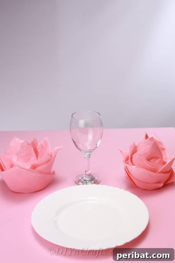 Fold Beautiful Napkin Roses 16 Finished napkin roses on a dinner table