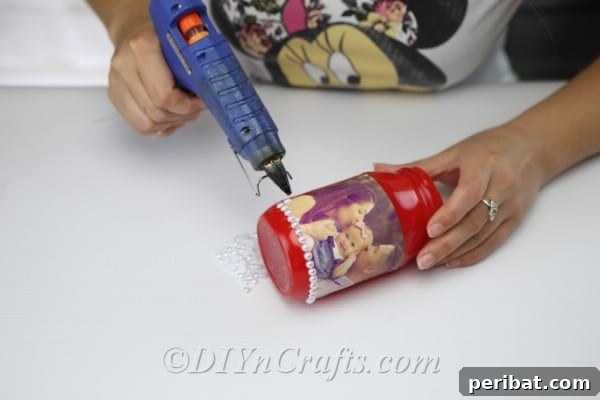 Create Stunning Photo Vases with Your Memories 11 Apply hot glue around the edges of the photograph to attach the pearls.
