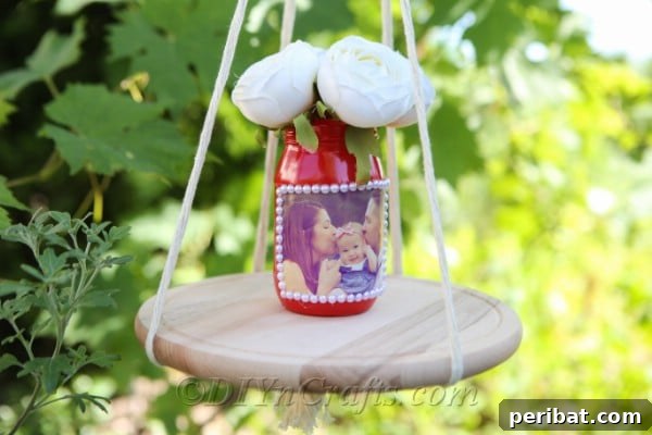 Create Stunning Photo Vases with Your Memories 16 A DIY vase displaying a photograph set out on a handcrafted shelf.