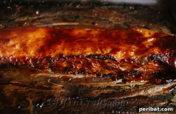 Effortless Fall-Off-The-Bone Oven Ribs 11 A baking sheet with a slab of oven baked ribs, seasoned and ready for the oven
