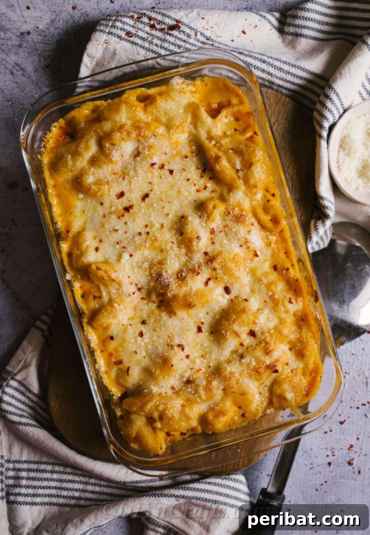 Decadent Homemade Mac and Cheese Bake 6 A large baking sheet filled with golden-brown, bubbly homemade baked mac and cheese, ready for a crowd.