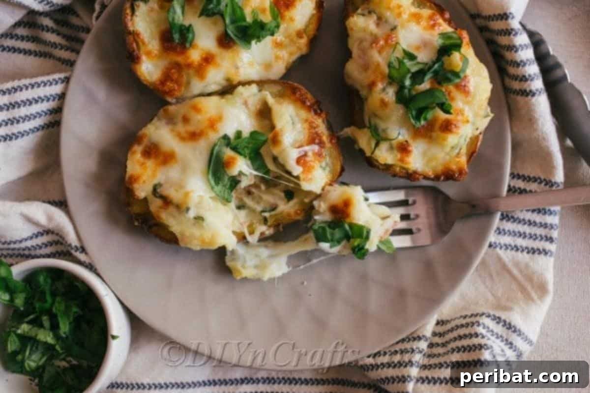 Simple Fully Loaded Potato Skins 5 A delightful overhead shot of several loaded potato skins arranged on a platter, with one skin showing a bite taken out, revealing its rich, cheesy interior.