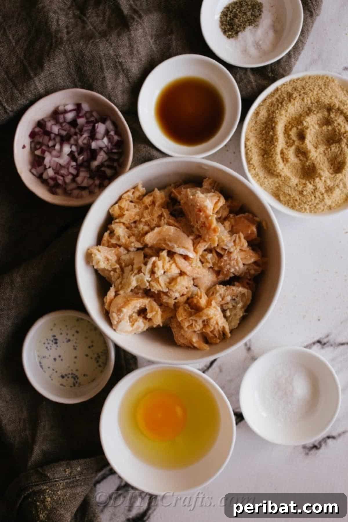 Ingredients for salmon patty recipe laying on a marble counter