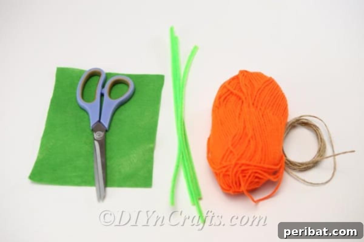 Handmade Autumn Yarn Pumpkin Garland Tutorial 6 Supplies for yarn pumpkin garland laying on flat white surface