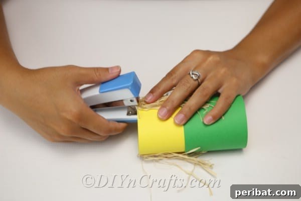 Attaching hair to core of scarecrow craft