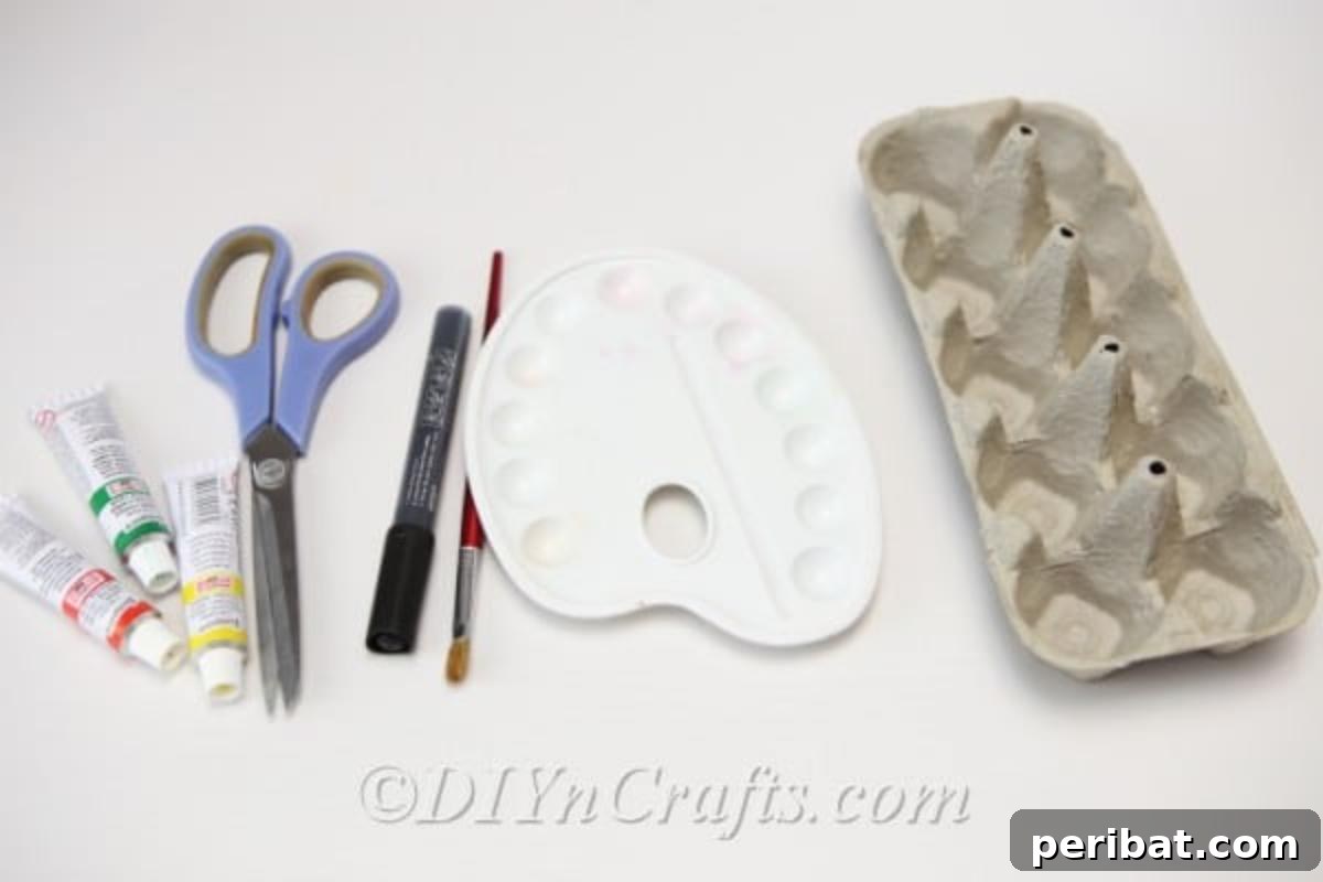 Craft supplies laid out on a table for making Halloween monster treat boxes