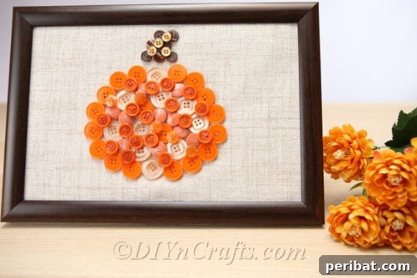 Pumpkin button art displayed on a countertop, ready to adorn your fall home decor