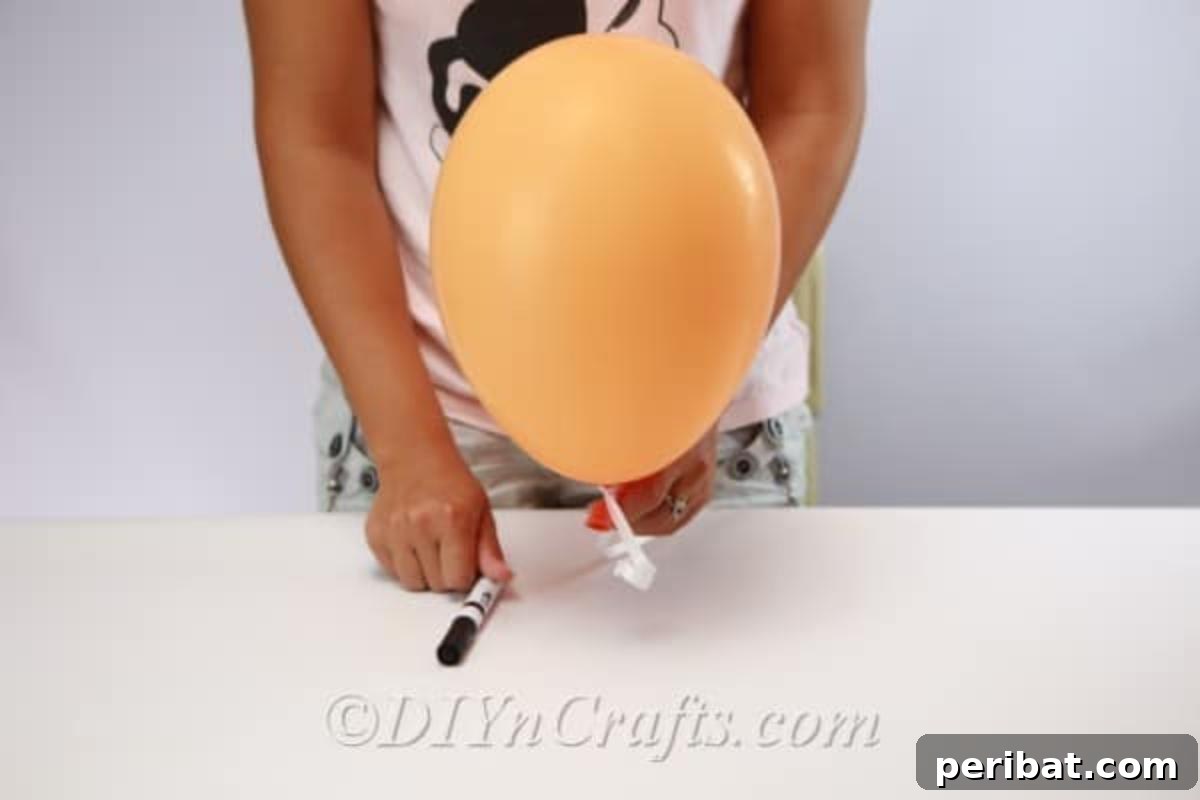 DIY Frightfully Fun Halloween Balloons 7 A close-up view of the simple supplies needed to make DIY Halloween balloons: balloons, string, and permanent markers.