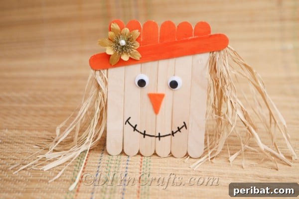 Finished project for how to make a scarecrow out of craft sticks