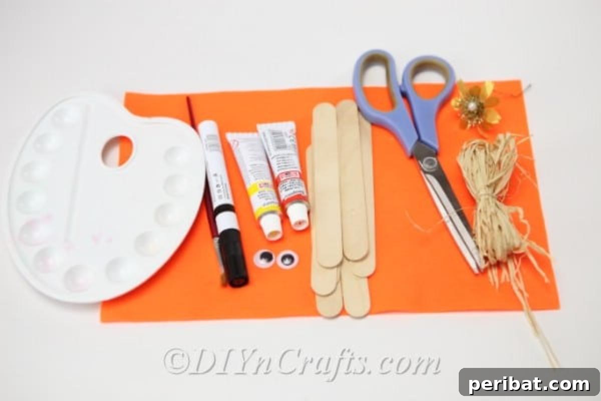 Supplies for how to make a scarecrow out of popsicle sticks
