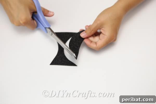 Cutting the mouth out of black foam