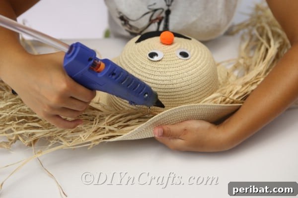 Adding hair to your harvest decor scarecrow craft