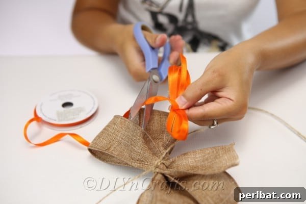 Making a bow to go on the harvest decor lady scarecrow