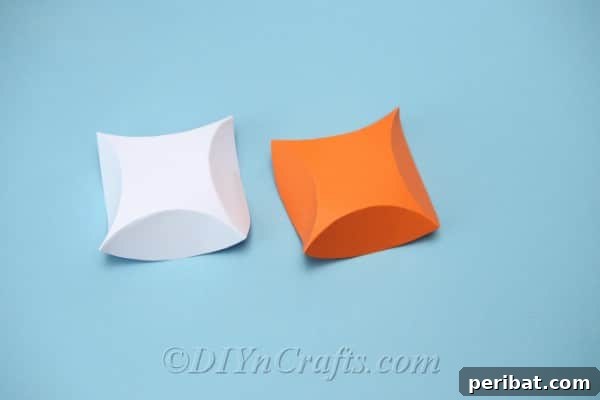 Craft Charming Pumpkin Gift Boxes 11 Both cardstock circles now folded into squares, ready for assembly into a gift box