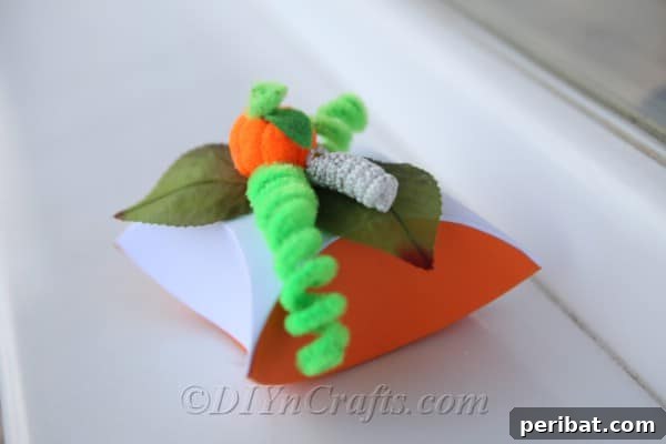 Craft Charming Pumpkin Gift Boxes 17 A completed DIY pumpkin gift box sitting on a white windowsill, ready to be filled