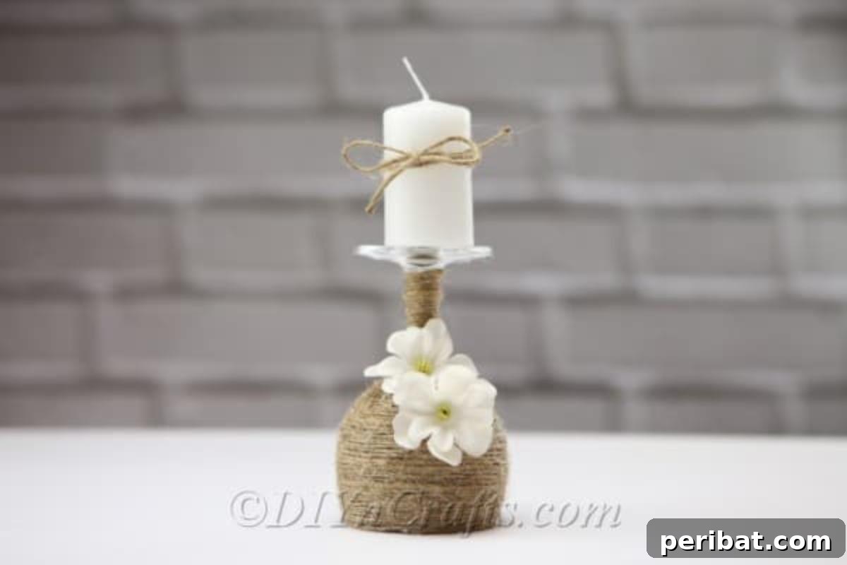 Rustic Glow: DIY Wine Glass Candle Holder 2 A beautifully crafted rustic candle holder made from an upcycled wine glass, featuring a warm candle on top, ready to illuminate any space.