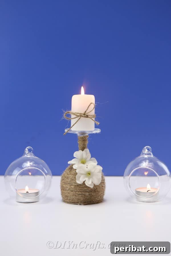 Rustic Glow: DIY Wine Glass Candle Holder 19 Three decorative candle holders, including the rustic wine glass design, arranged together as a captivating centerpiece.