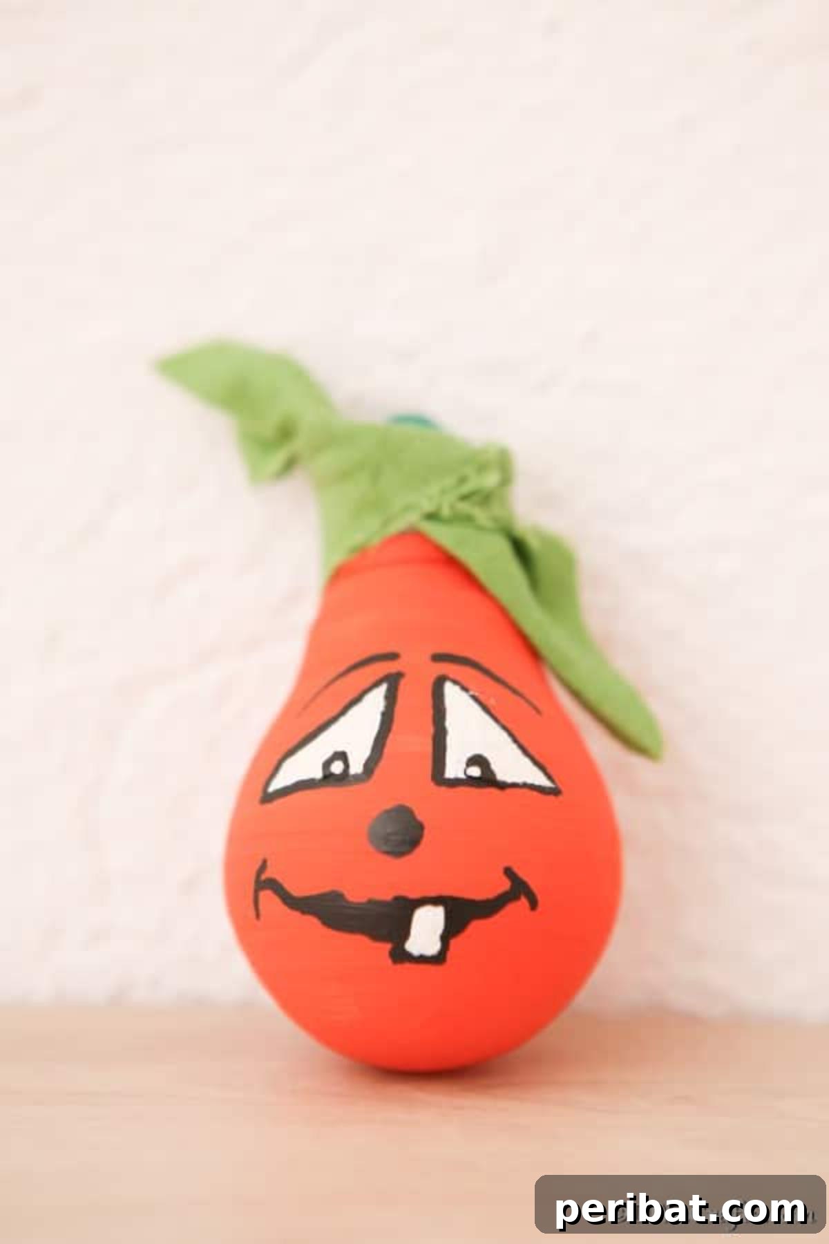 Crafting Spooky Ghosts and Pumpkins from Light Bulbs 4 Painted orange pumpkin decorative light bulbs idea for Halloween