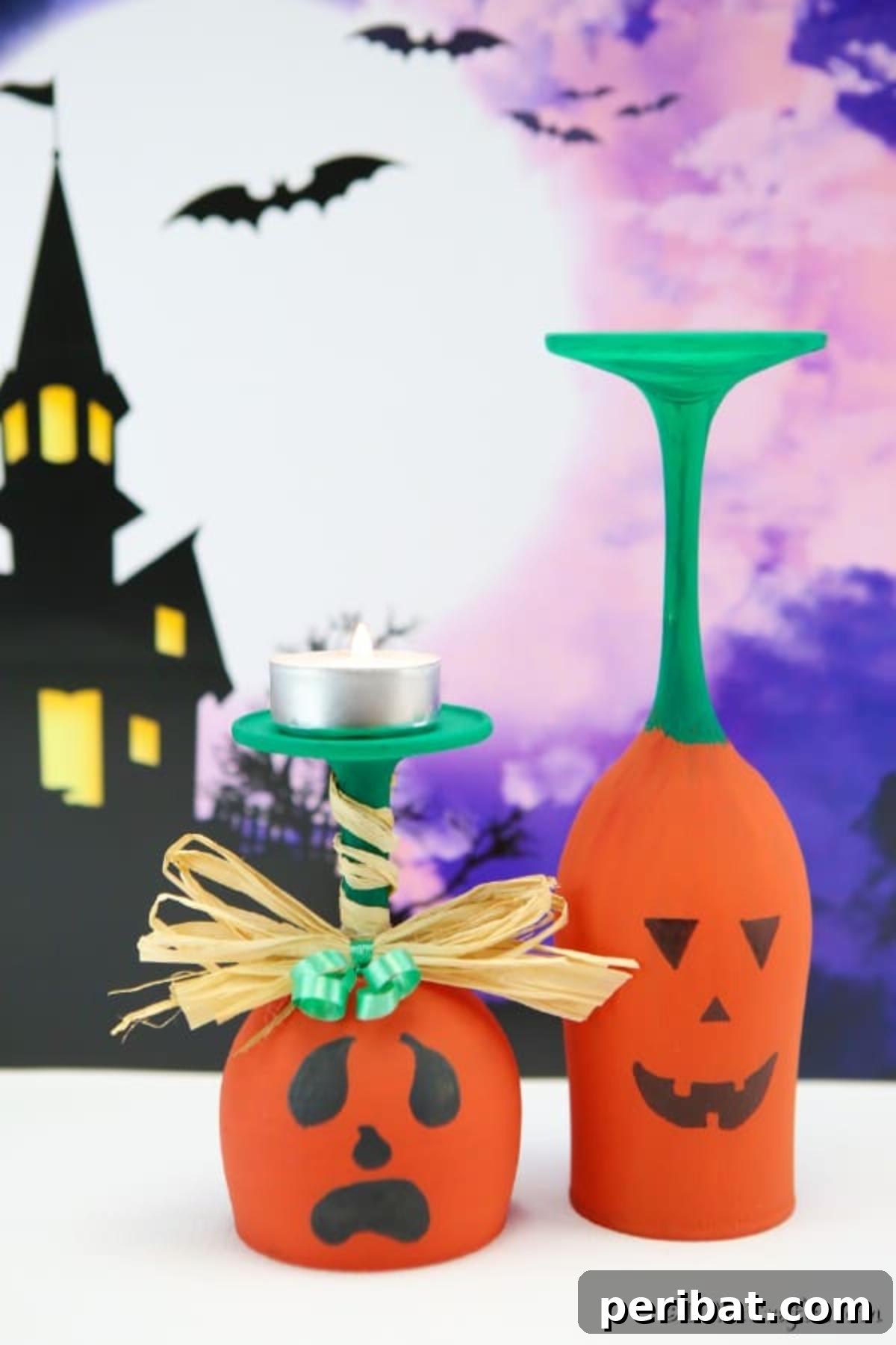Two charming wine glass pumpkins with distinct faces, set against a festive purple Halloween background, ready for display.