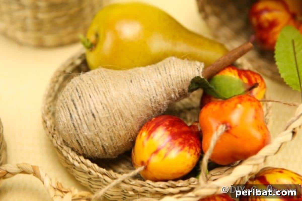 Handcrafted Twine Pear Bulb Art 5 A basket full of fruit pieces including the wrapped pear fruit decoration