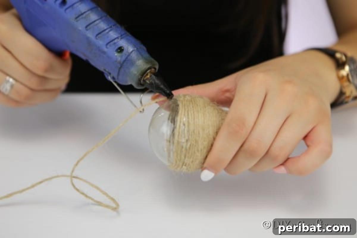 Handcrafted Twine Pear Bulb Art 9 Gluing the twine around the pear fruit decoration