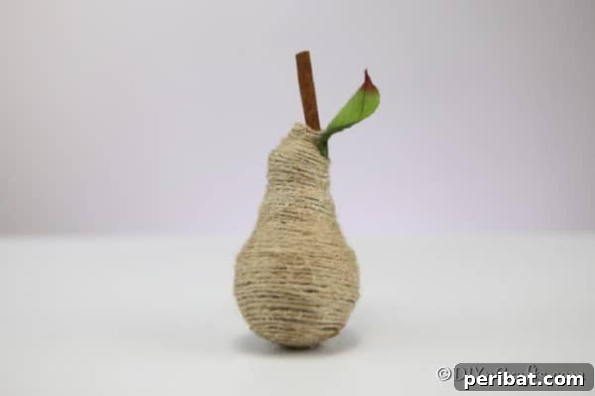 Handcrafted Twine Pear Bulb Art 10 A finalized twine wrapped pear fruit decoration
