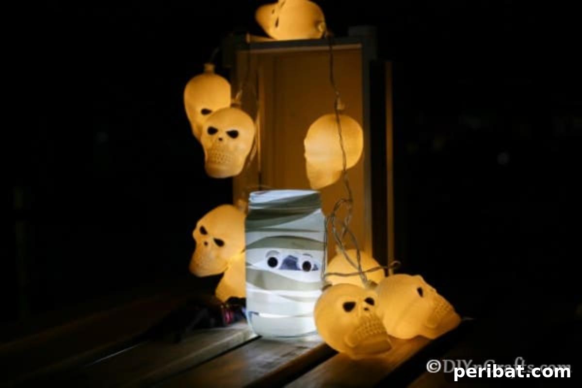 A cluster of mummy mason jar lights with varying googly eyes, casting a warm, ghostly glow in a dark room, highlighting their hand-crafted texture.