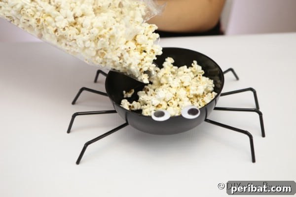 Halloween Spider Web Treat Bowl DIY 15 Filling the halloween spider bowl with popcorn