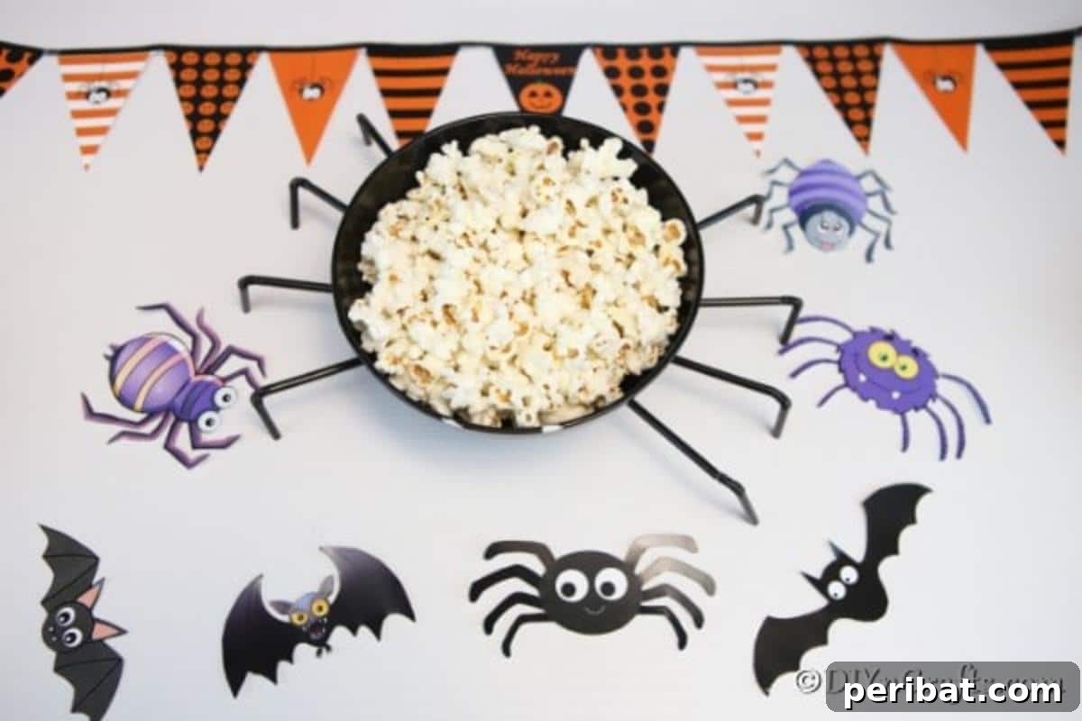 Halloween Spider Web Treat Bowl DIY 4 An overhead picture of the halloween spider bowl filled with popcorn and sitting on a purple halloween paper