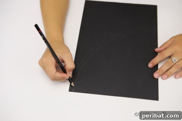 Bewitching DIY Witch Hat for Halloween 12 Tracing the curve on black cardboard for a witch hat